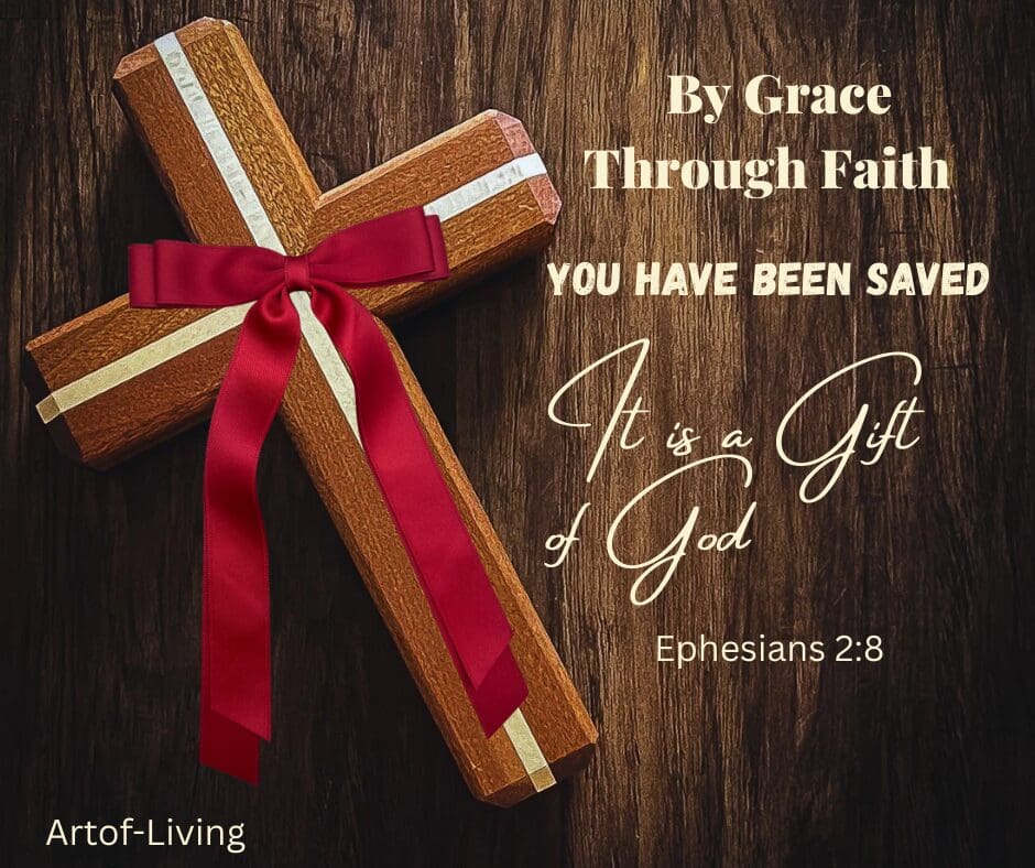 Wooden cross with red ribbon and scripture